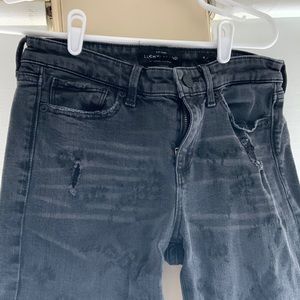 Lucky brand, size 6, distressed black jeans with embroidered pattern